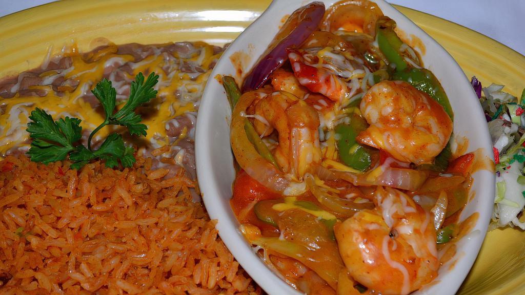 Camarones Con Crab · Prawns with King crab sauteed in butter, garlic, onions tomatoes and salsa. Served with three tortillas. Our house specials include rice and beans.