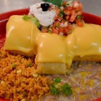 Pollo Fundido · Shredded chicken wrapped with a crispy flour tortilla. Topped with cream cheese and American...