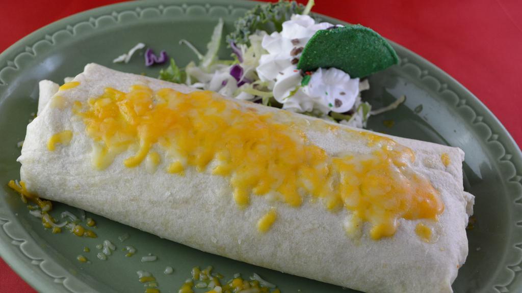 Bean & Cheese Burrito · A flour tortilla filled with beans and cheese. Topped with melted cheese and sour cream.