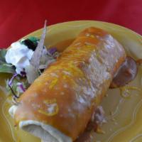 Super Burrito · Not spicy. A soft flour burrito filled with beef and beans with cheese. Topped with rancera ...