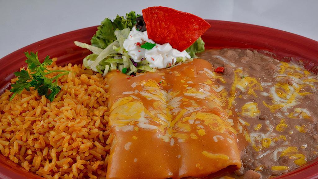 Enchiladas Dnr · Your choice of cheese, chicken or beef. Topped with sauce and garnished with sour cream. Our house specials include rice and beans.