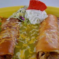 Tres Delicias Enchiladas · Beef, chicken and cheese enchiladas. Covered in 3 different salsas. Garnished with sour crea...