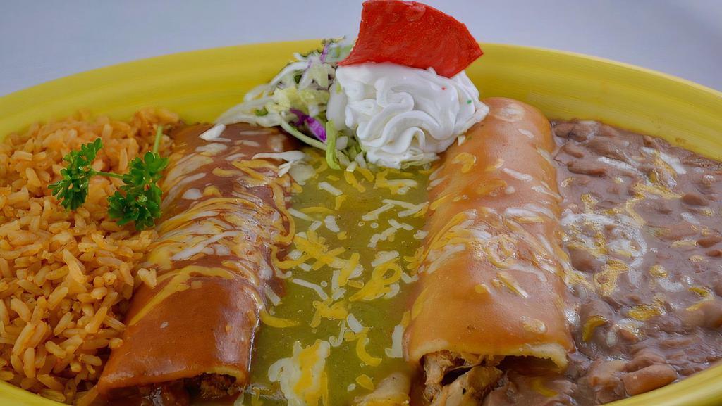 Tres Delicias Enchiladas · Beef, chicken and cheese enchiladas. Covered in 3 different salsas. Garnished with sour cream. Our house specials include rice and beans.