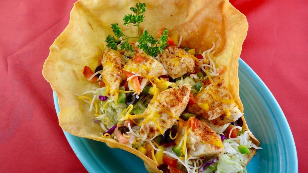 Halibut Salad · Grilled halibut, lettuce, tomatoes,onions, bell peppers, olives, cheese, ranch dressing, on a a large flour tortilla.