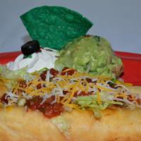 Ala Flautas · 2 flour tortillas rolled with beef or chicken with cheese. Covered with lettuce, guacamole a...