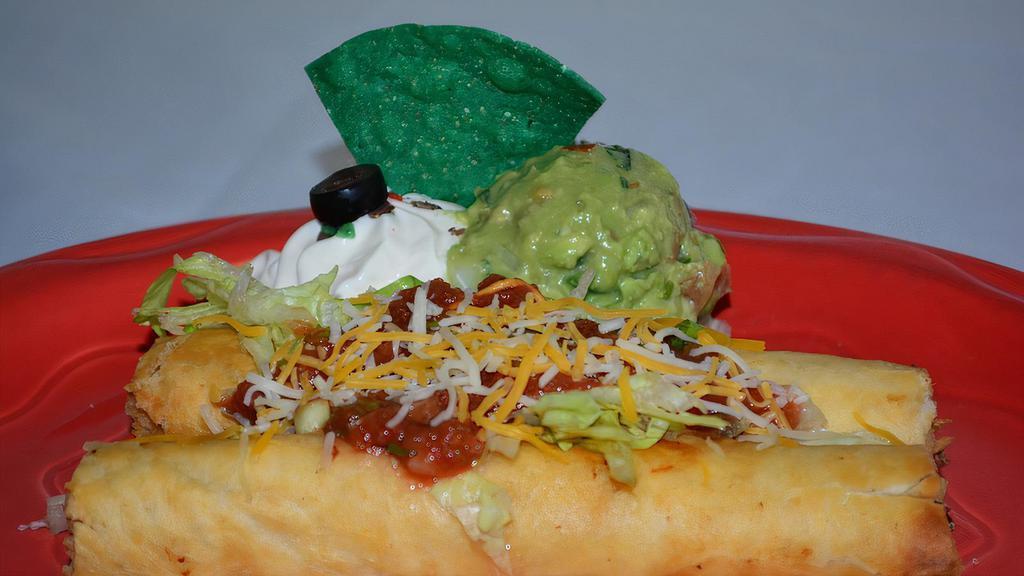 Ala Flautas · 2 flour tortillas rolled with beef or chicken with cheese. Covered with lettuce, guacamole and sour cream.