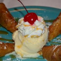Dessert Chimi · Creamy heesecake and tasty toppings wrapped in a sweet and crispy tortilla. Topped with dulc...