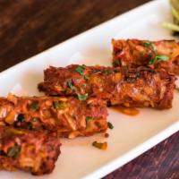 Seekh Kabab · Skewered minced lamb kabab flavored with mint and cilantro.