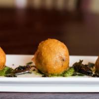 Aloo Bonda · Spiced mashed potatoes engulfed in a coating of chick pea batter.