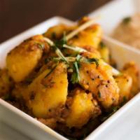 Aloo Ke Gutke · Potatoes with curry leaves and mustard seeds.