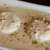 Rasmalai (Nuts) · Contains nuts. Cottage cheese dumpling in a reduced milk sauce with cardamom and pistachio.