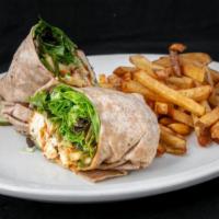 Buffalo Chicken Wrap · Crispy chicken tenders, blue cheese dressing, cucumbers, mixed greens, grilled wheat tortill...