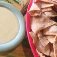 Chips & Cheese Dip · Fresh avocado hass, onions, fresh lime juice, tomatoes and cilantro.