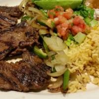 Carne Asada (Dinner) · Grilled steak with sauteed jalapenos and onions. Served with Mexican rice, beans and corn to...