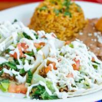 Taco Platter · 3 tacos with your choice of meat served with Mexican rice and beans. All tacos are topped wi...