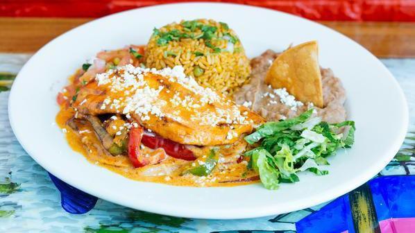 Chipotle Chicken · A delicious stuffed chicken breast with chorizo, peppers and cheese drizzled with chipotle sauce. Served with Mexican rice and beans.