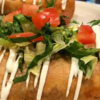 Chimichanga · A flour tortilla stuffed with Mexican rice, beans, cheese, and your choice of meat deep frie...