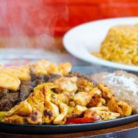 Fajitas · Your choice of meat with sautéed peppers and onions. Served with Mexican rice, beans, lettuc...