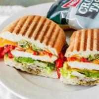 Chicken Avocado · Romaine lettuce, grilled chicken, avocado, cheddar cheese, roasted red peppers, tomatoes and...