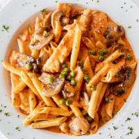 Penne Ragazzi · Penne sautéed with mushrooms, peas and chopped chicken in a blush sauce.