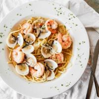 Shrimp & Clams · Jumbo shrimp and clams with red pepper in a white or red sauce served over linguini.