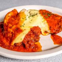 Chicken Parmigiana · With spaghetti. Served with soup or salad, roll, and butter.