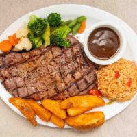 Rib Eye Steak · 12 oz. rib eye steak, red wine & pepper sauce.