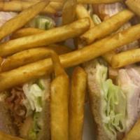 Turkey Sandwich Club · Served with French fries, bacon, lettuce, tomato, mayonnaise & cheese.