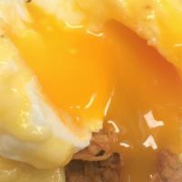 Eggs Benedict · Two poached with Canadian bacon on a toasted English muffin topped with hollandaise sauce.