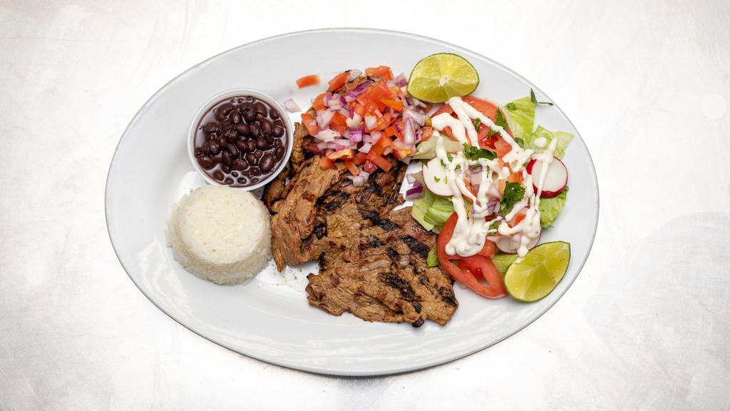Carne Asada · Grilled steak, served with rice, beans and salad