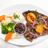 Grilled T-Bone Steak · T-bone steak, grilled jumbo shrimp, served with rice and beans