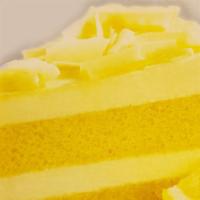 Limoncello Mascarpone Cake (Slice) · Rich combination of lemon infused sponge cake and mascarpone topped with white chocolate cur...