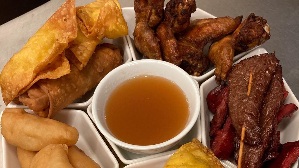 Pu Pu Platter For Two · Teriyaki (two), fried shrimp (two), egg rolls (two), chicken fingers (six), chicken wings (four). crab rangoon (four), and boneless spareribs (four).