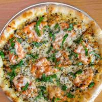 Margarita Pizza · pesto sauce, tomatoes, mozzarella cheese, and fresh basil.