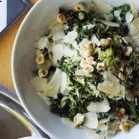 Kale Salad (V)(G) · brussels sprouts, parmesan, hazelnuts, verjus vinaigrette. . Allergens: tree nut, dairy