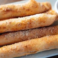 Garlic Bread Sticks · Bread, topped with garlic, herb seasoning, baked to perfection.
