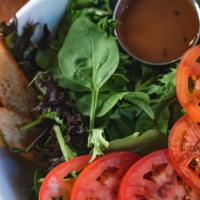 House Salad  · Mixed wild greens and Roma tomatoes with balsamic vinaigrette dressing served with croutons.