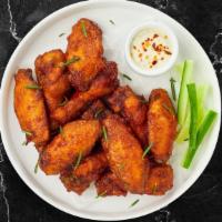 Classic Chicken Wings · Fresh chicken wings and fried until golden brown. Served with a side of ranch or bleu cheese.