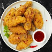 Seismic Sweet And Chili Wings · Fresh chicken wings , fried until golden brown, and tossed in sweet chili sauce. Served with...