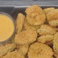 Fried Pickles · Dill pickle chips, hand battered in our very own spicy seasoning blend. Served with tangy bo...