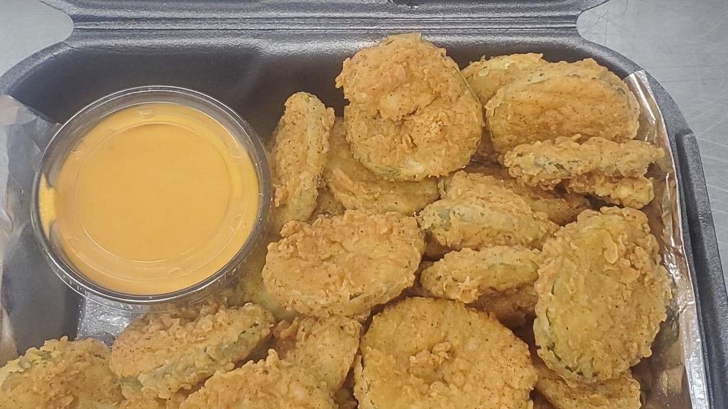 Fried Pickles · Dill pickle chips, hand battered in our very own spicy seasoning blend. Served with tangy boom-boom sauce.
