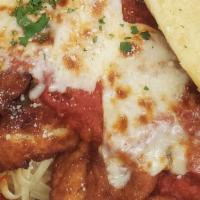 Chicken Parmesan · A hearty portion, hand breaded with Italian seasoning, smothered with zesty marinara sauce, ...