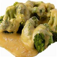 Cheesy Broccoli · Fresh broccoli brushed with butter and covered with cheese sauce.