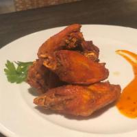 Chicken Wings · Grilled or deep fried marinated chicken wings served with Swahili sweet sauce.