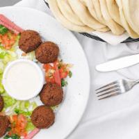 Falafel · Ground chick peas and fava beans freshly fried to a golden brown