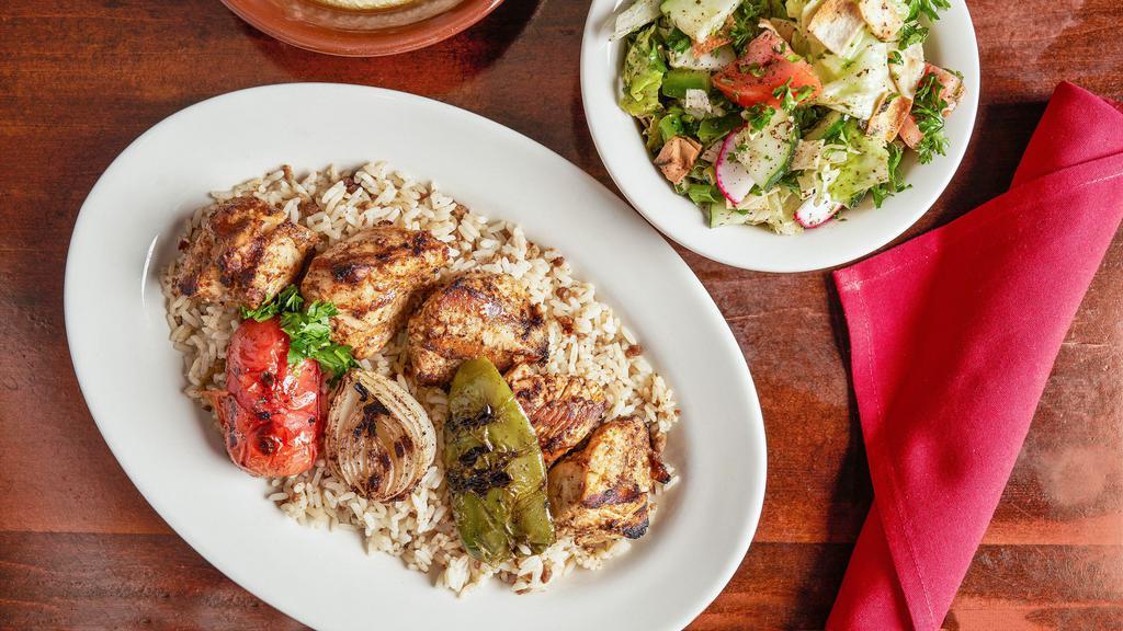Chicken Kabob · Tender chunks of chicken breast marinated with special spices and charbroiled. served with rice or steak fries hummus and homemade salad.