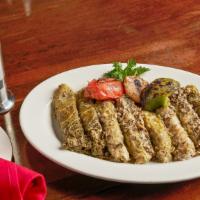 Rolled Cabbage · Rolled cabbage leaves stuffed with rice, ground meat, cooked with lemon, garlic and mint