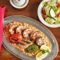 Shrimp Kabob* · One of our most popular dishes. Jumbo shrimp marinated and skewered over the charcoal grill....