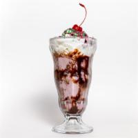 Sundae · Two scoops of sweet cream ice cream with whipped cream and cherry.
