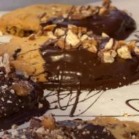 Twix Cookie · Large Chocolate Chip and Twix cookie half dipped in chocolate with Twix pieces sprinkled on ...
